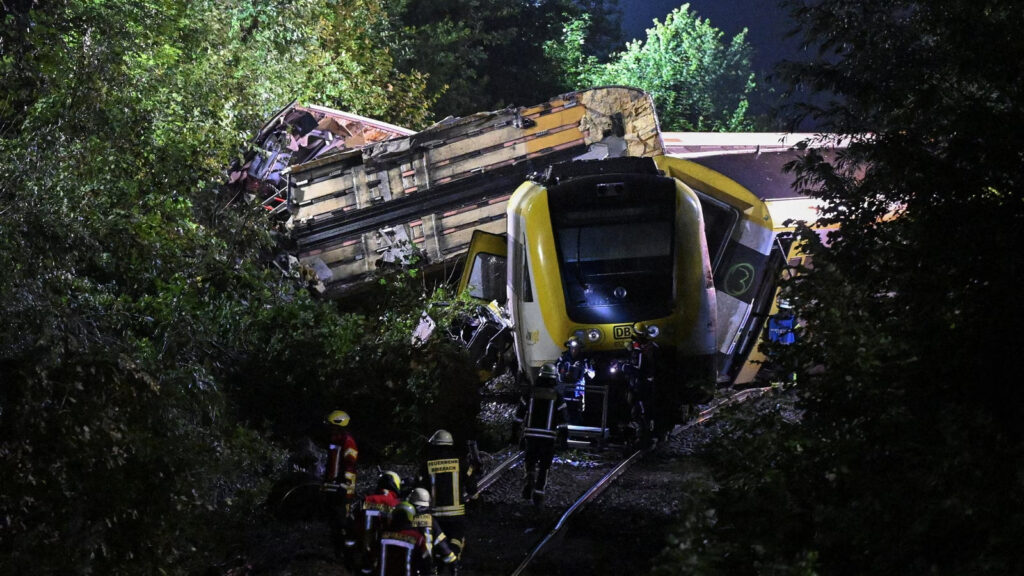 Overturned regional train carriages jackknifed in forest after Germany rail accident near Ulm, July 2025.