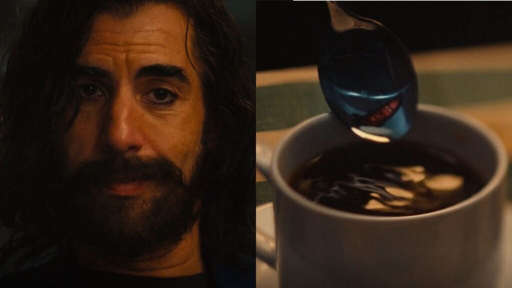 Sacha Baron Cohen as Mephisto in Marvel's Ironheart, smiling slyly with a spoon reflecting his demonic form