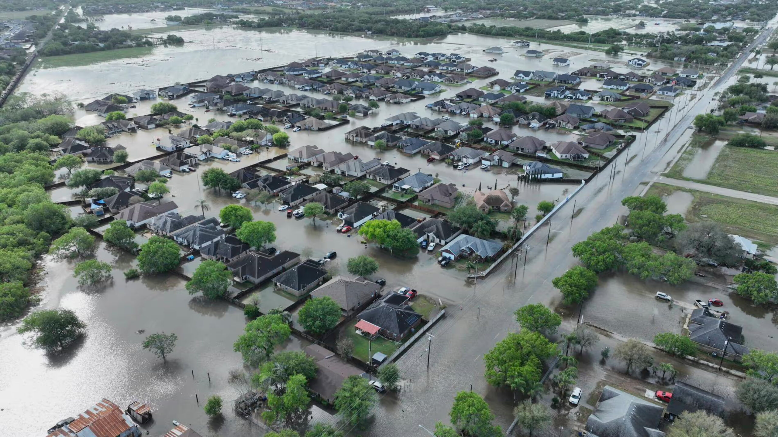 Drone view of Guadalupe River flood destruction in Kerrville, Texas, showing submerged homes and debris (July 5, 2025)