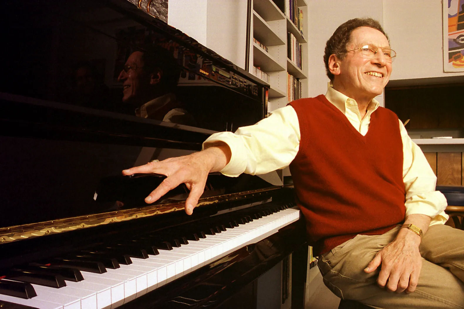 Tom Lehrer, satirist and mathematician, seated at his piano in his Santa Cruz home in 2000.