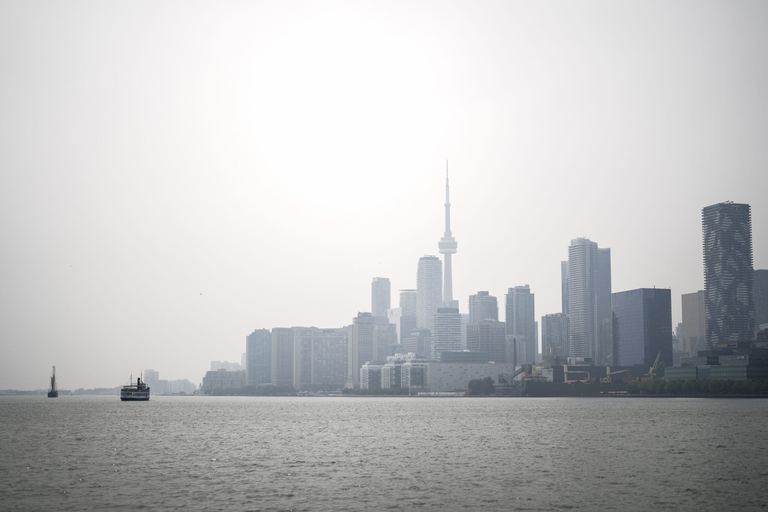 Toronto skyline obscured by wildfire smoke on July 14, 2025, during record air pollution event