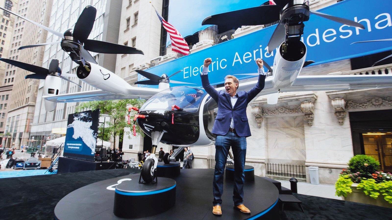 Joby Aviation's all-electric eVTOL aircraft in flight over urban skyline, showcasing the future of emission-free air taxi transportation.
