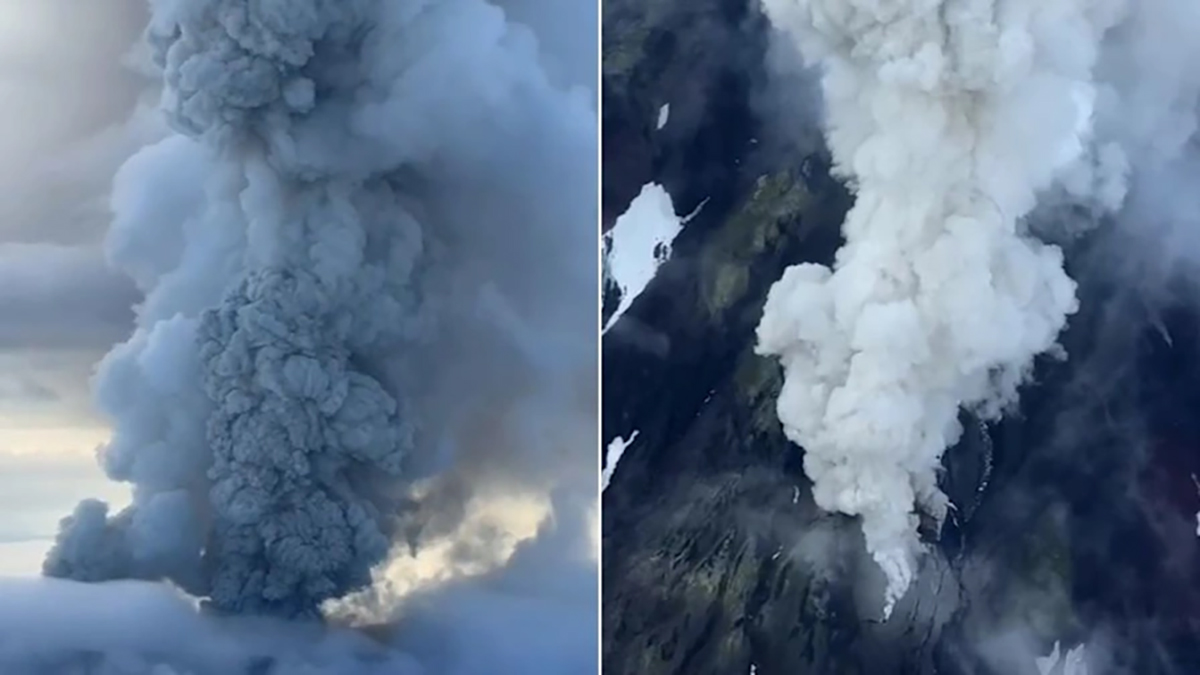 Eruption of Krasheninnikov Volcano showing massive ash plume rising above snow-covered Kamchatka landscape.